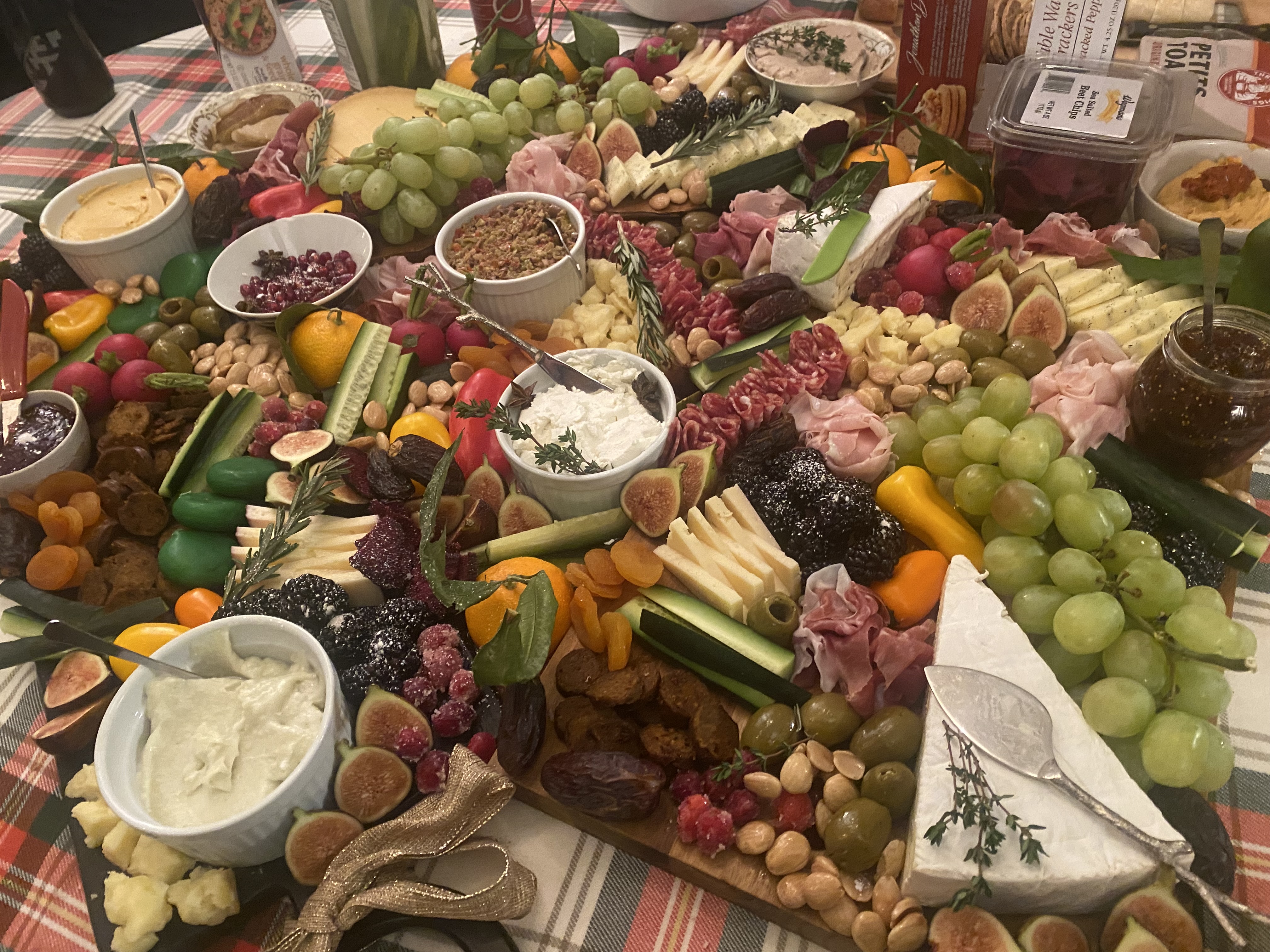 A huge charcuterie board meant to feed 20 people.