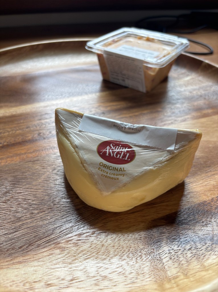 A triangle of Saint Angels triple creme cheese.
